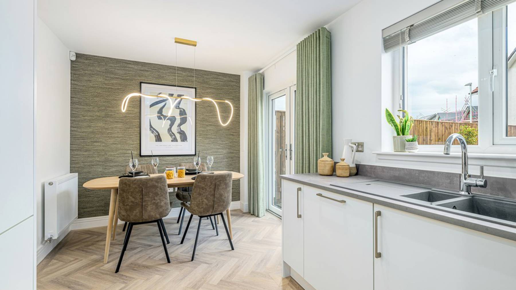 3 bedroom showhome | open plan kitchen, dining and family area with French doors to rear garden