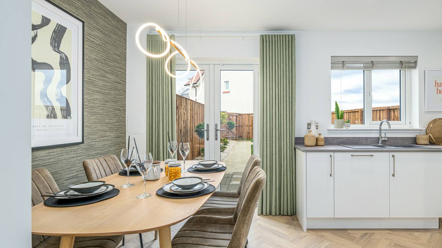 3 bedroom showhome | high spec kitchen and dining area with French doors to the garden