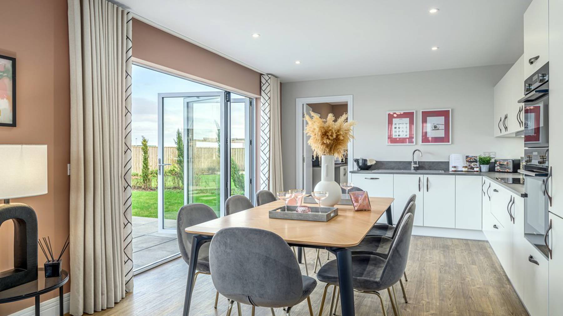 4 bedroom showhome | open plan kitchen, dining and family area with bi-fold doors to rear garden
