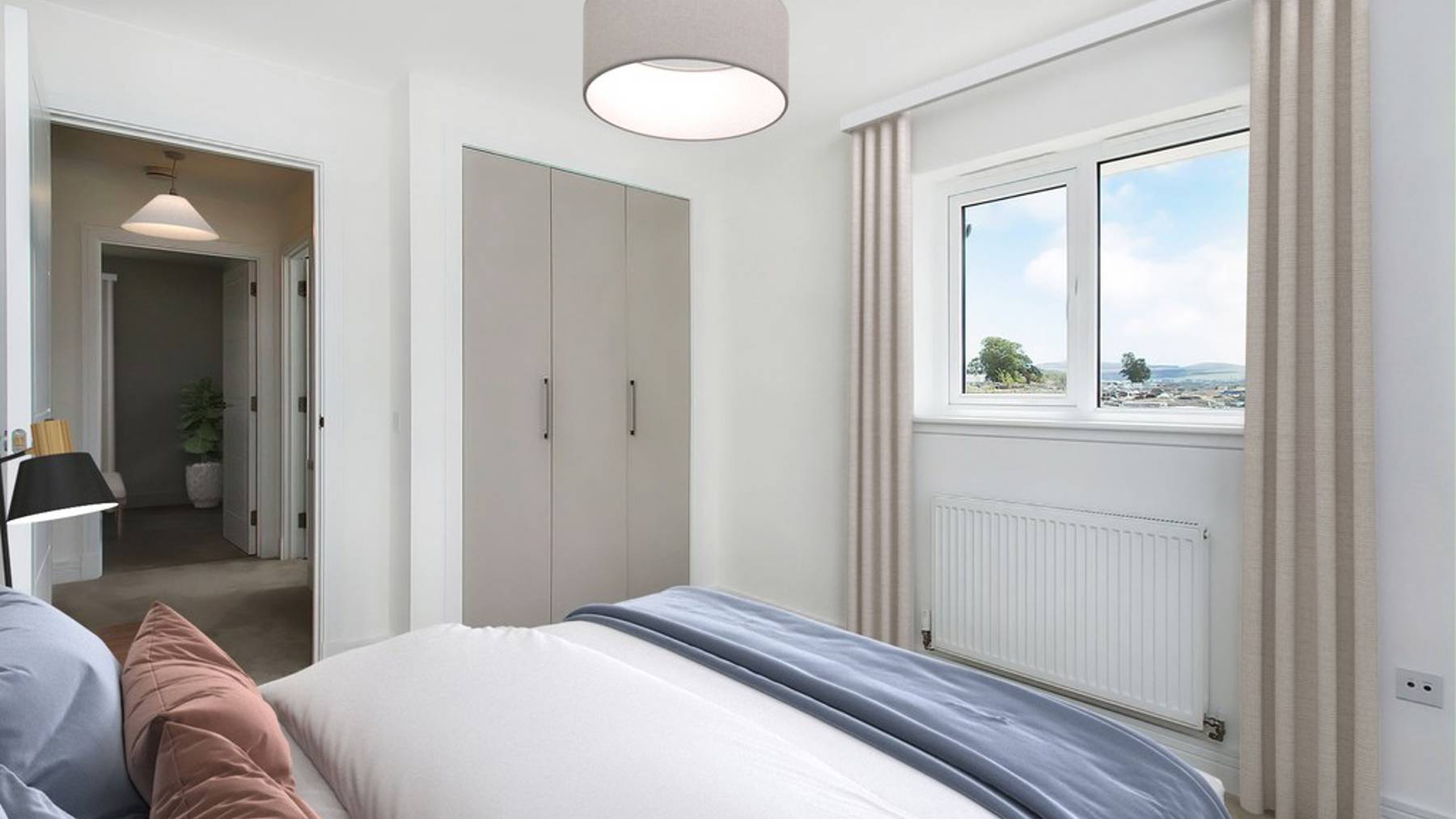 3 bedroom showhome | second bedroom with built-in storage and soft neutral tones