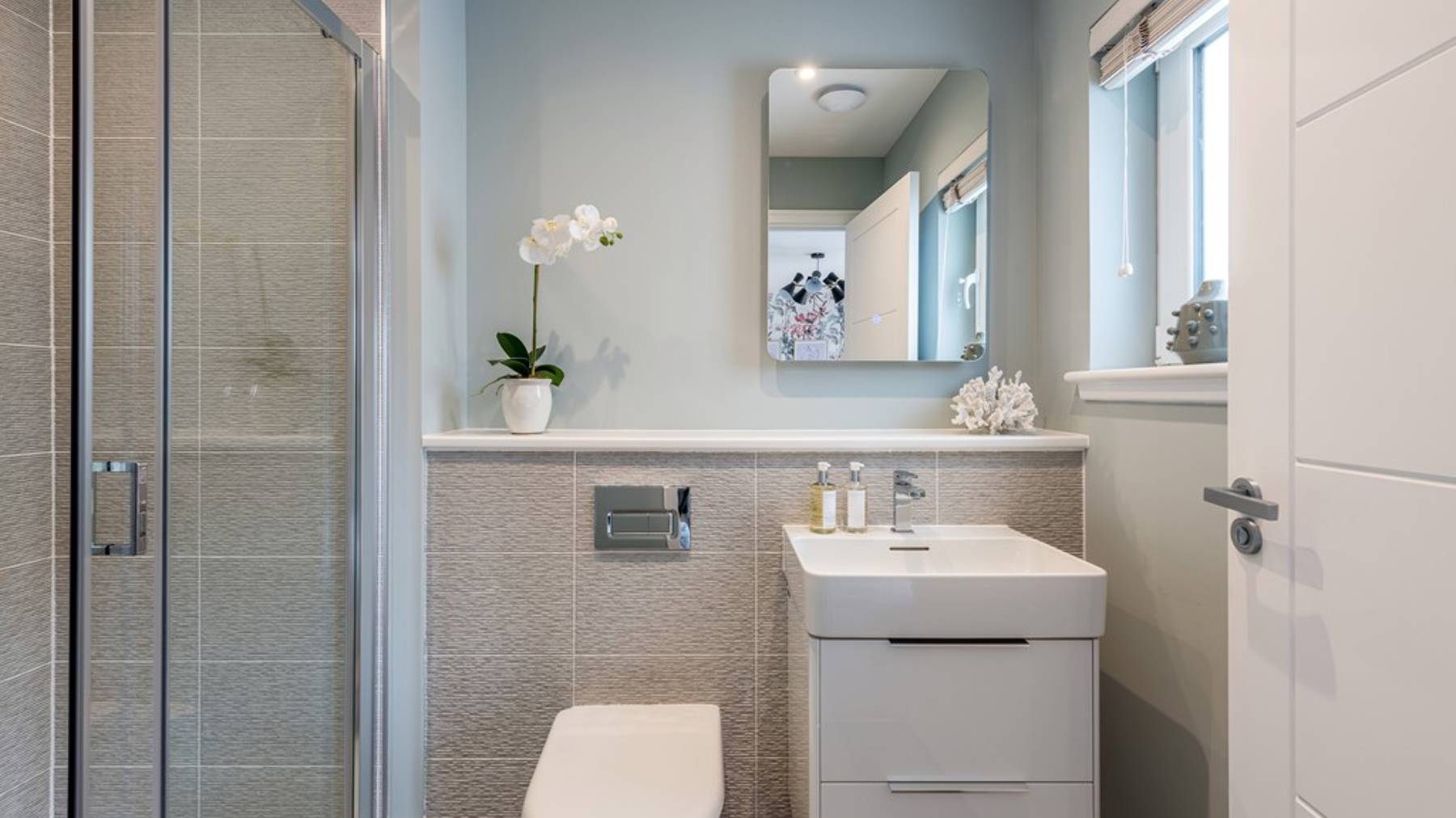 4 bedroom showhome | sleek en suites with chrome fittings and full-height tiling