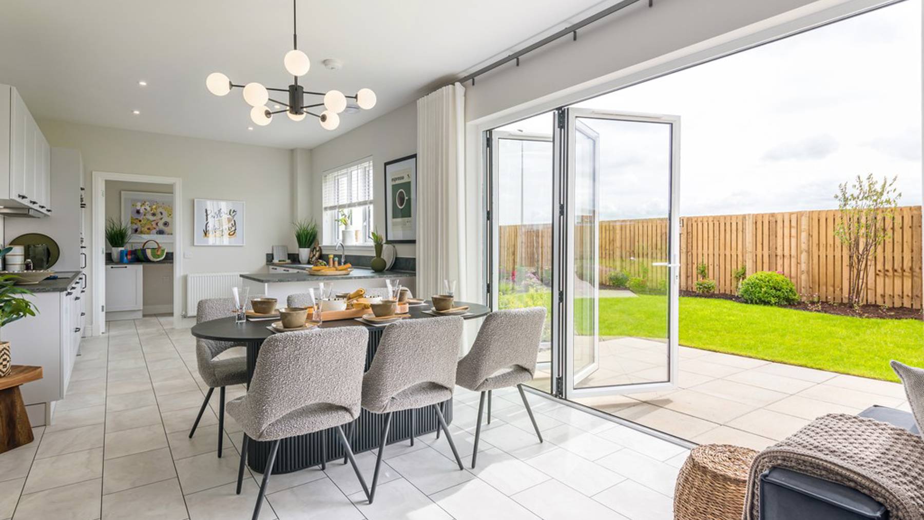 5 bedroom showhome | impressive high spec kitchen, dining and lounge area with bi-fold doors to the garden