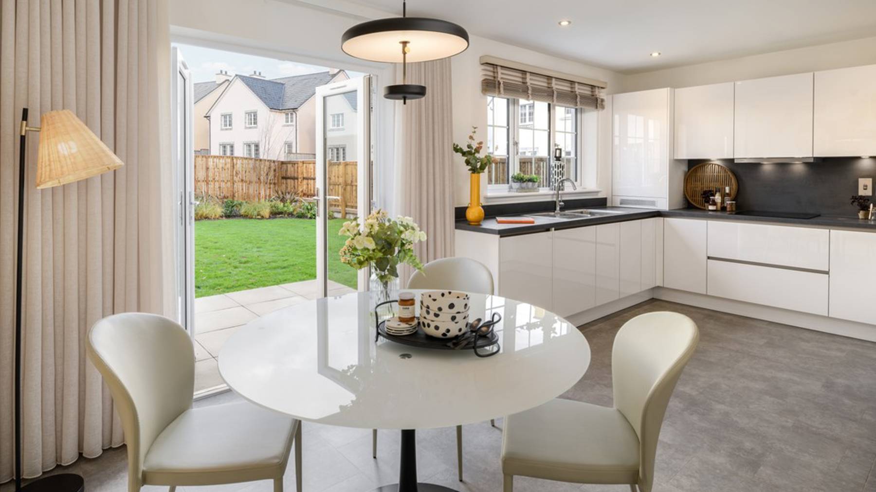 3 bedroom showhome | open plan kitchen and dining area with French doors to rear garden