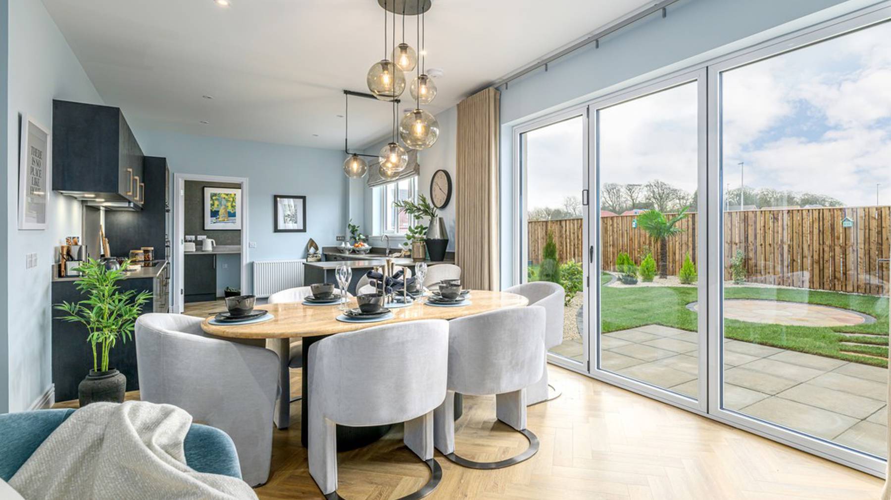 5 bedroom showhome | open plan studio-style kitchen, dining and family area with bi-fold doors to garden