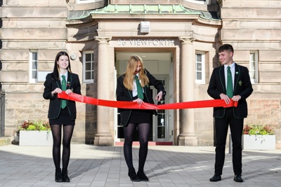 Pupils return to former school for grand entranceway opening at landmark restoration