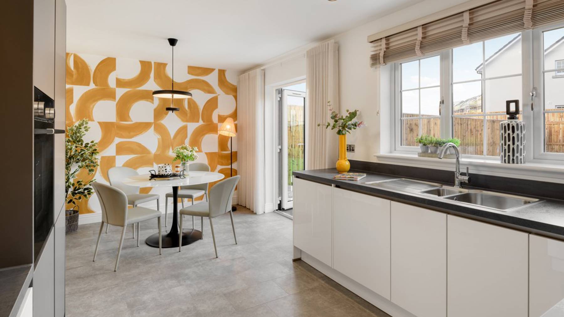 3 bedroom showhome | open plan kitchen and dining area with French doors to rear garden