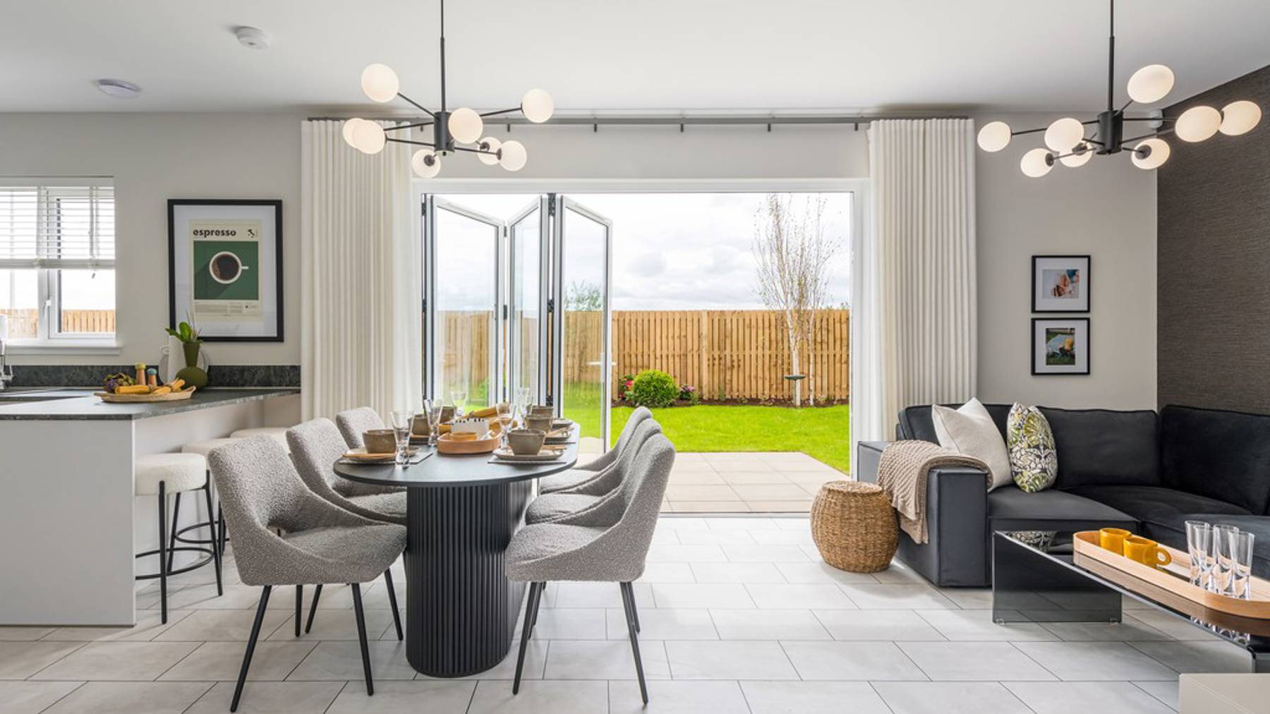 5 bedroom showhome | open plan studio-style kitchen, dining and family area with bi-fold doors to garden