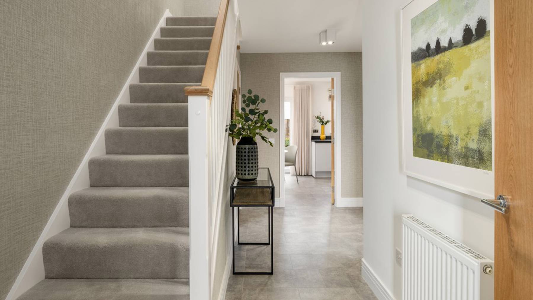 3 bedroom showhome | welcoming entrance hallway with cloakroom and access to lounge