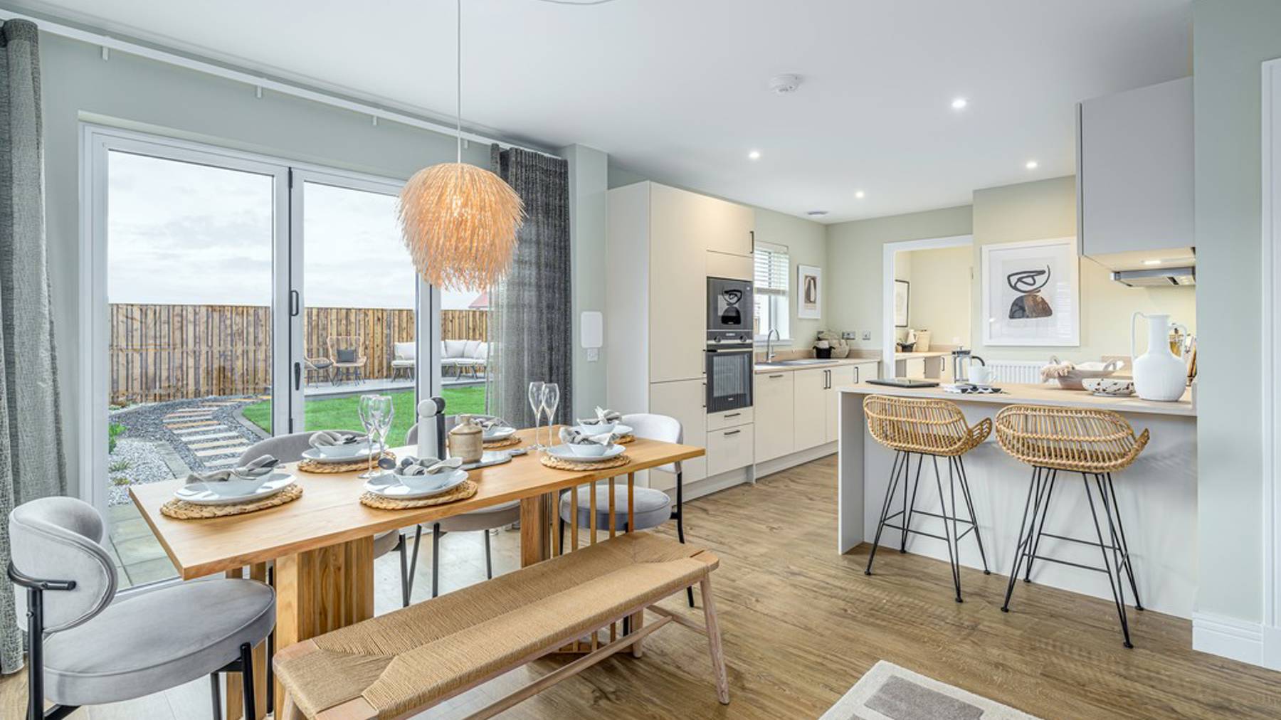4 bedroom showhome | open plan studio-style kitchen, dining and family area with bi-fold doors to rear garden