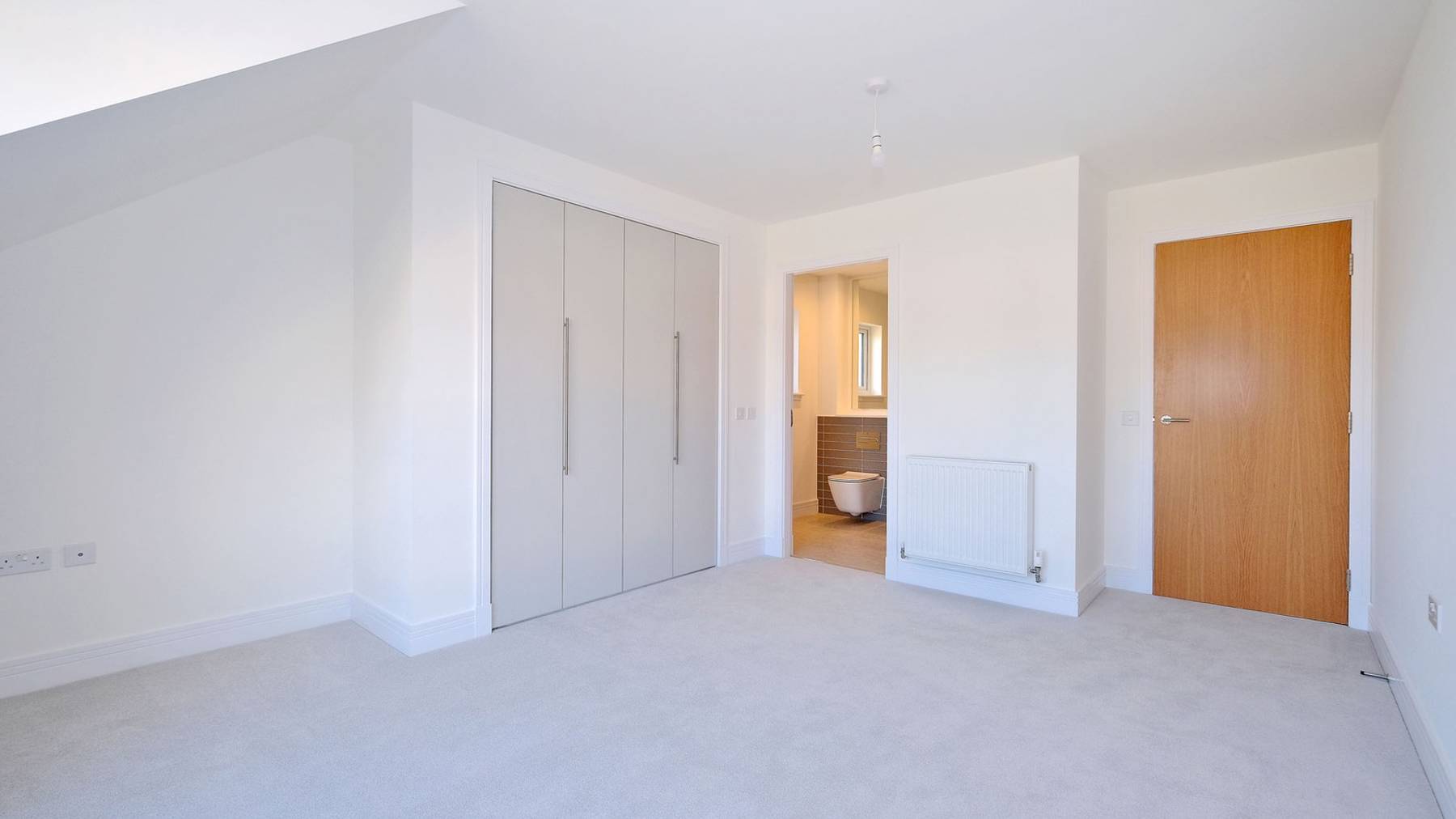 Large main bedroom with ensuite and cupboards 